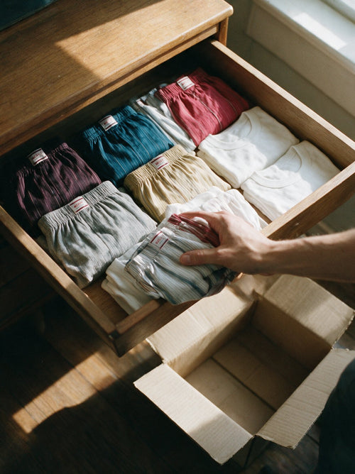 A drawer of neatly folded Mody basics